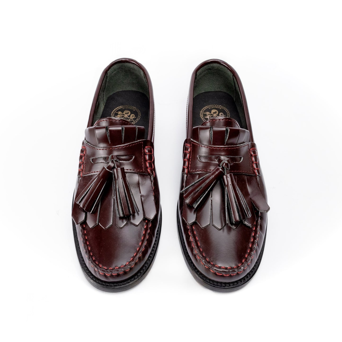 Mocassini in pelle con frangia e nappine bordeaux