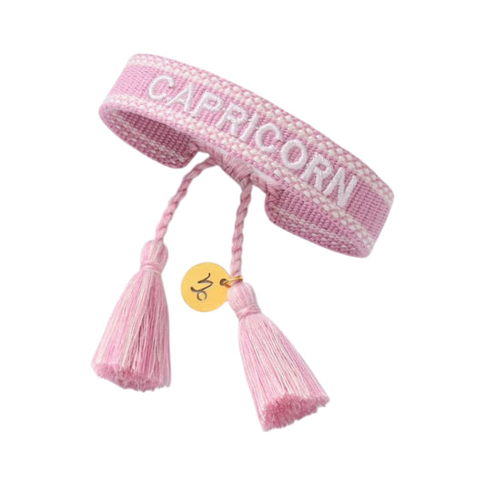 Bracciale in tessuto lilla con scritta Capricorn e charm