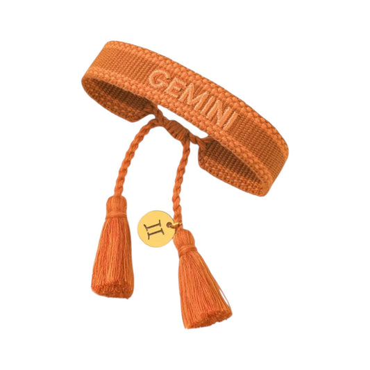 Bracciale in tessuto arancio con scritta Gemini e charm