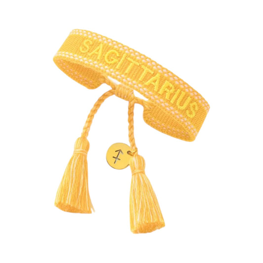 Bracciale in tessuto oro con scritta Sagittarius e charm